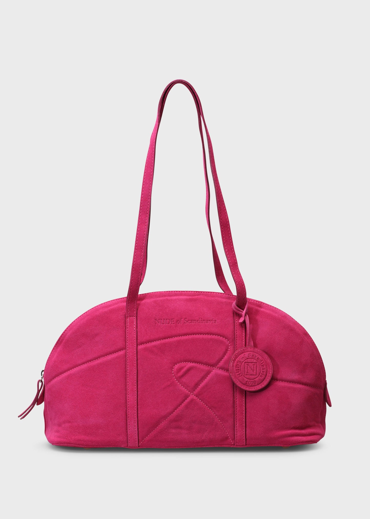 Pink handbag with a brand logo on a light gray background