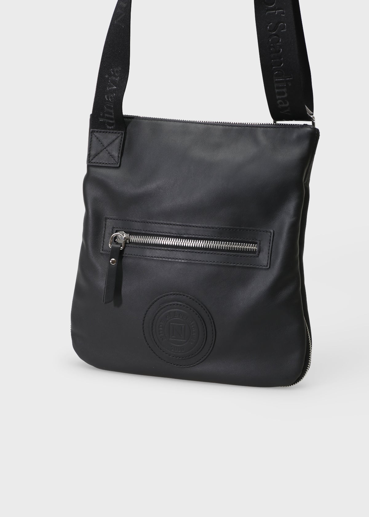 Black leather shoulder bag with a visible brand logo on a white background