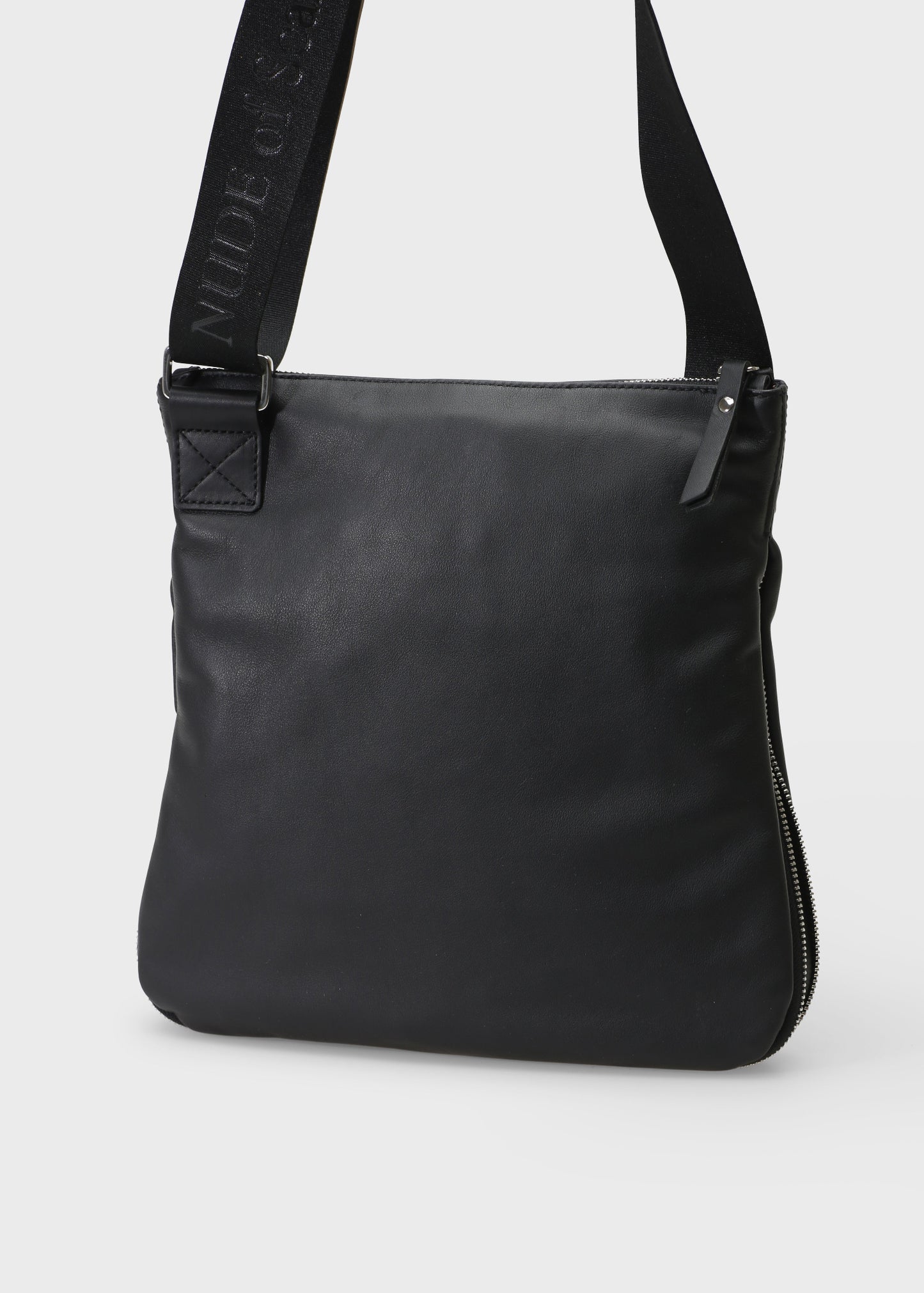Black leather crossbody bag on a white background