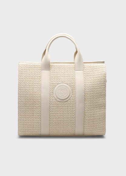 Beige woven handbag with a visible brand logo on a light gray background