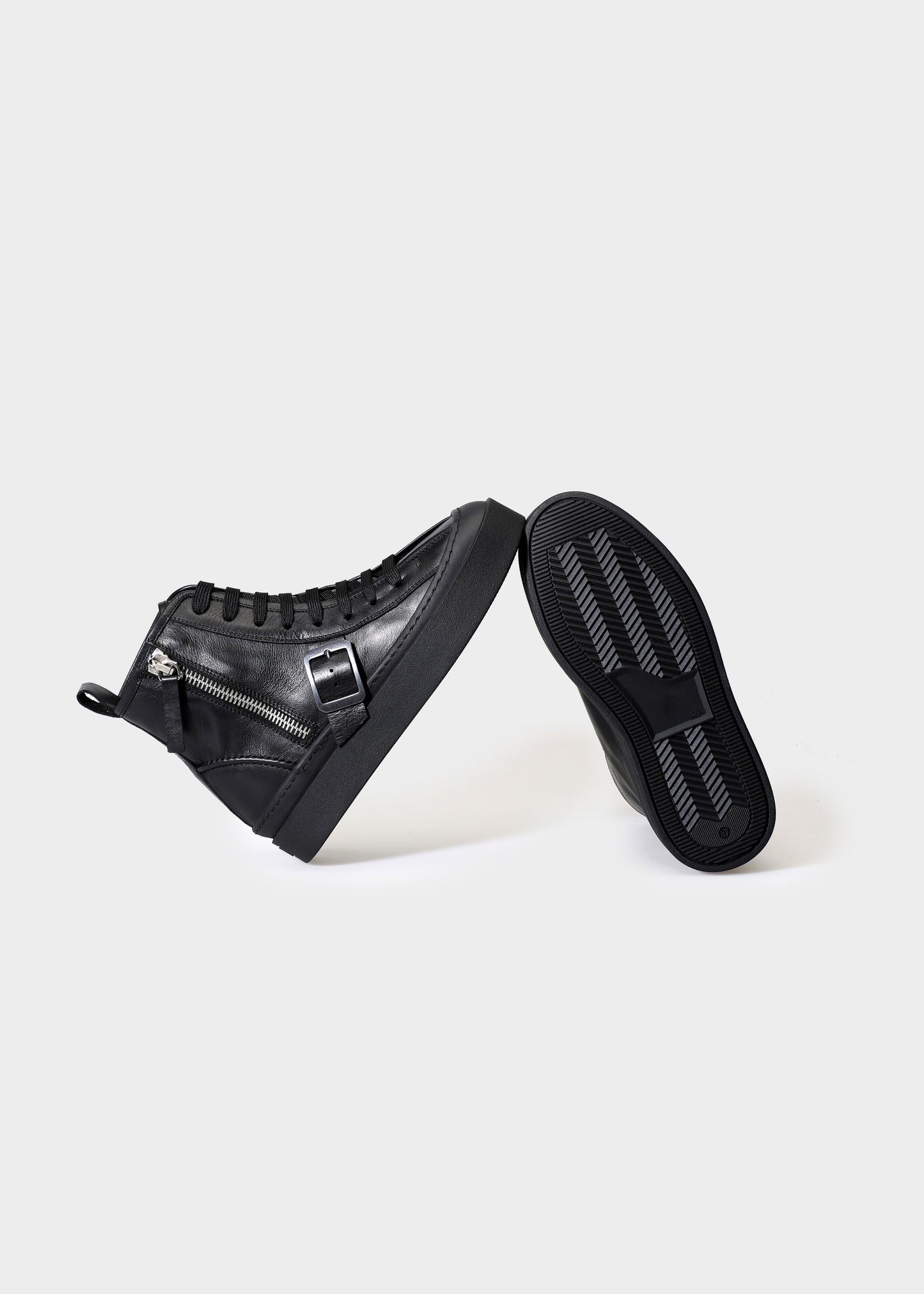 Black high-top sneakers on a white background